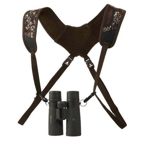 Badlands Bino Basic harness in camo and brown with ventilated shoulder straps and black binoculars attached.