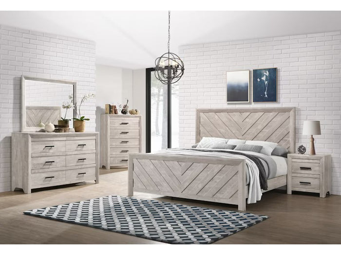 Close-up front view of the vertical mirror, clearly showcasing its distinctive chevron wood frame and distressed finish atop a dresser.