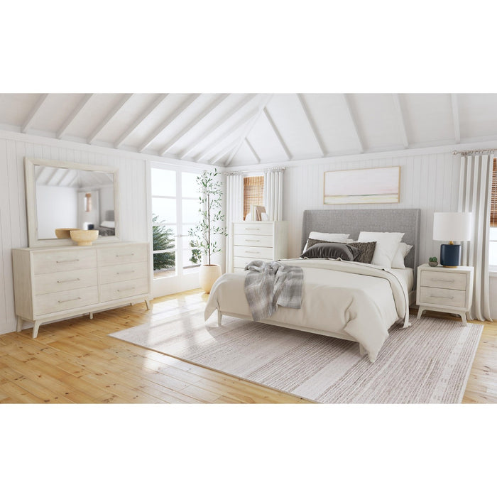 Full view of the rectangular mirror set atop its matching light wood dresser, showcasing the product clearly against a bright, airy room background.
