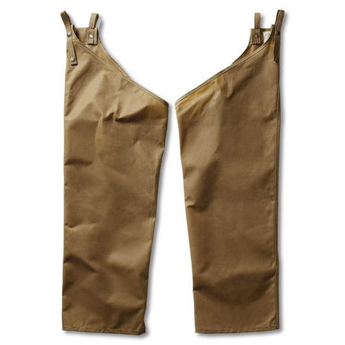 Tan Filson Oil Finish Tin Cloth chaps featuring durable cotton duck fabric, adjustable belt straps, and snap closures.