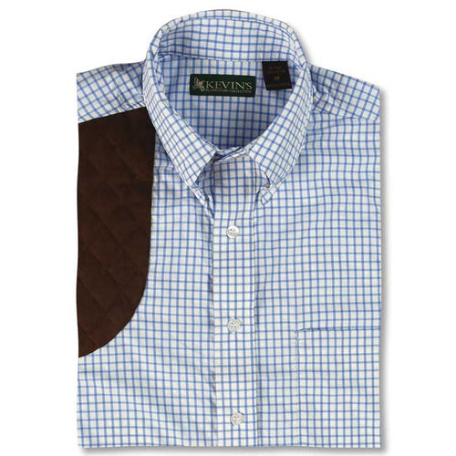 Blue tattersall performance shooting shirt with a brown quilted recoil pad patch and pearl buttons.