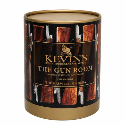 Kevin's The Gun Room soy candle in a cylindrical gold tin featuring a decorative shotgun stock pattern.