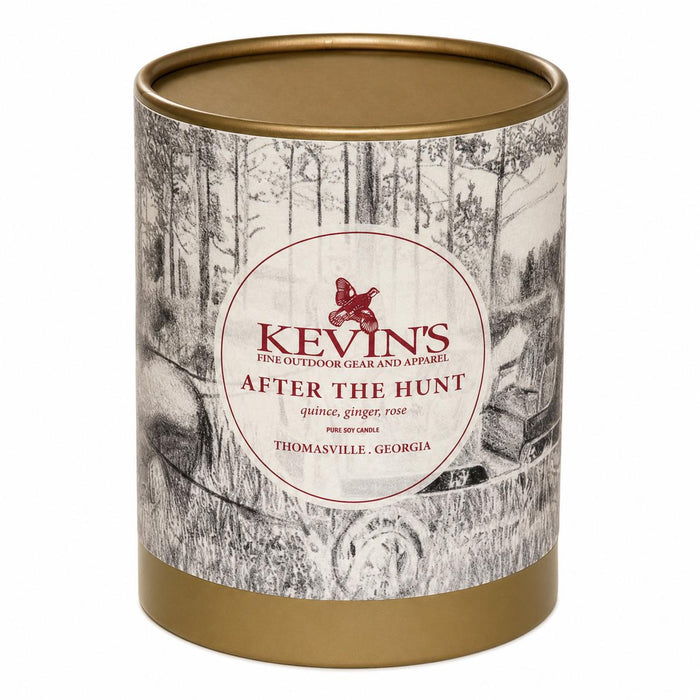 Kevin's After The Hunt soy candle in a cylindrical container with a gold lid and a black-and-white forest illustration.