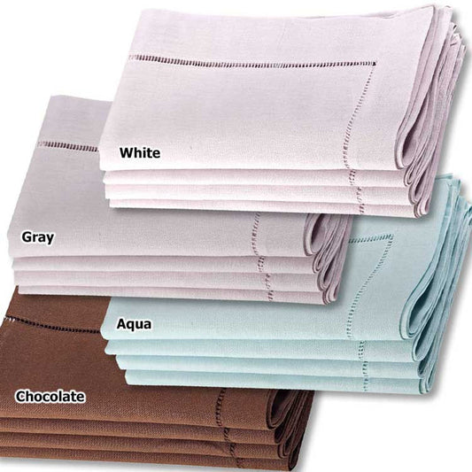Stacks of 20x20 inch linen-cotton blend napkins in white, gray, aqua, and chocolate with hemstitched border detailing.