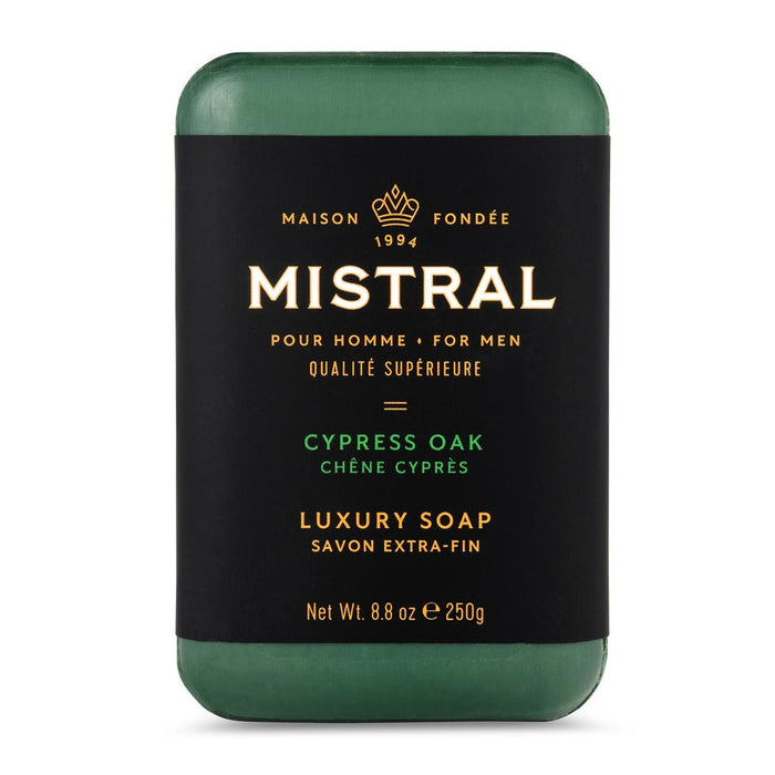 Mistral Cypress Oak men's bar soap in a dark green hue with a black label featuring gold text and a crown logo.