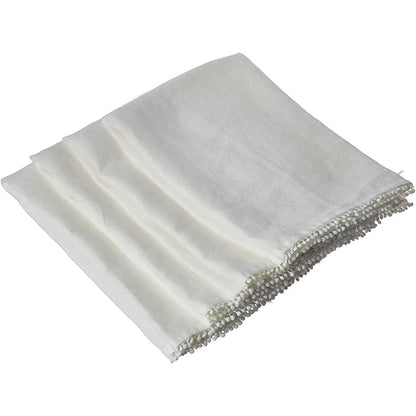 Folded white linen-cotton blend napkin featuring delicate handcrafted pompom trim along the edge.