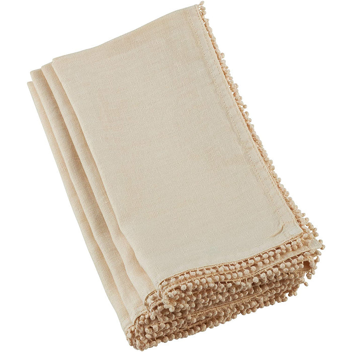 Folded beige linen-cotton blend napkin featuring delicate pom-pom trim edging for an elegant, textured table setting.