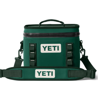 Green YETI Hopper Flip 8 soft cooler with a top handle, waterproof zipper, and adjustable padded shoulder strap.