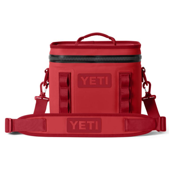 Red YETI Hopper Flip 8 soft cooler with a top handle, waterproof zipper, and detachable padded shoulder strap.