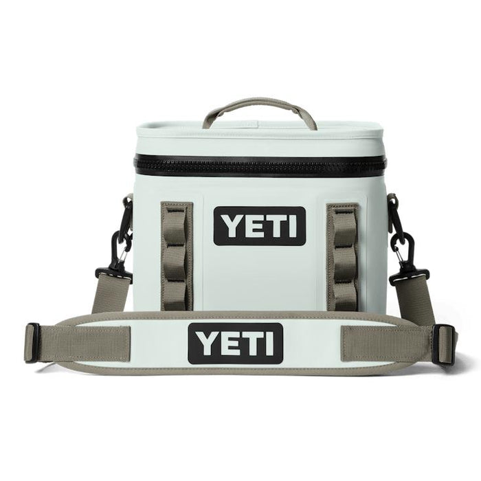 Light gray YETI Hopper Flip 8 soft cooler with a waterproof zipper, top handle, and adjustable padded shoulder strap.
