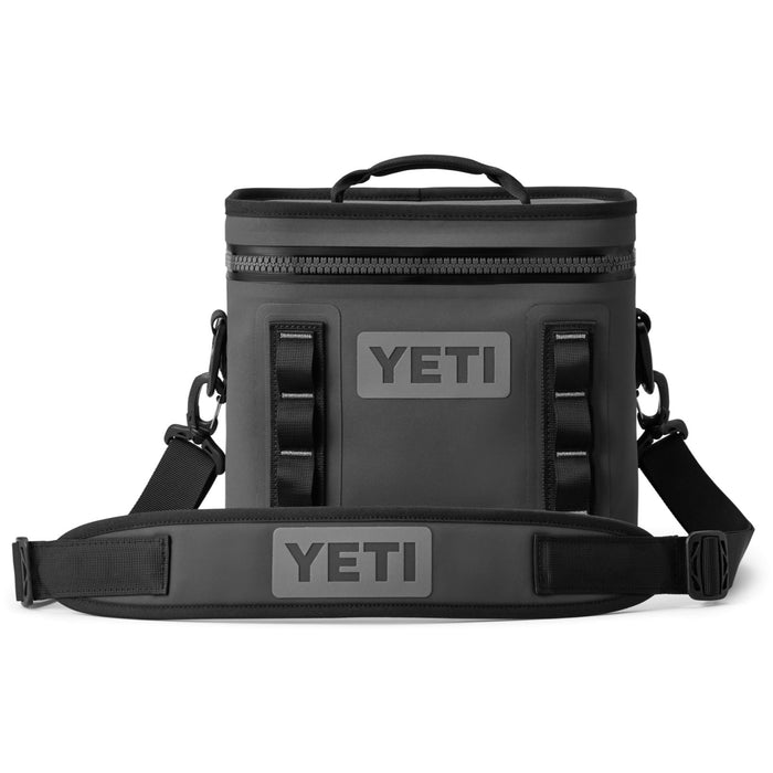 Charcoal grey YETI Hopper Flip 8 soft cooler with a waterproof zipper, top handle, and adjustable padded shoulder strap.